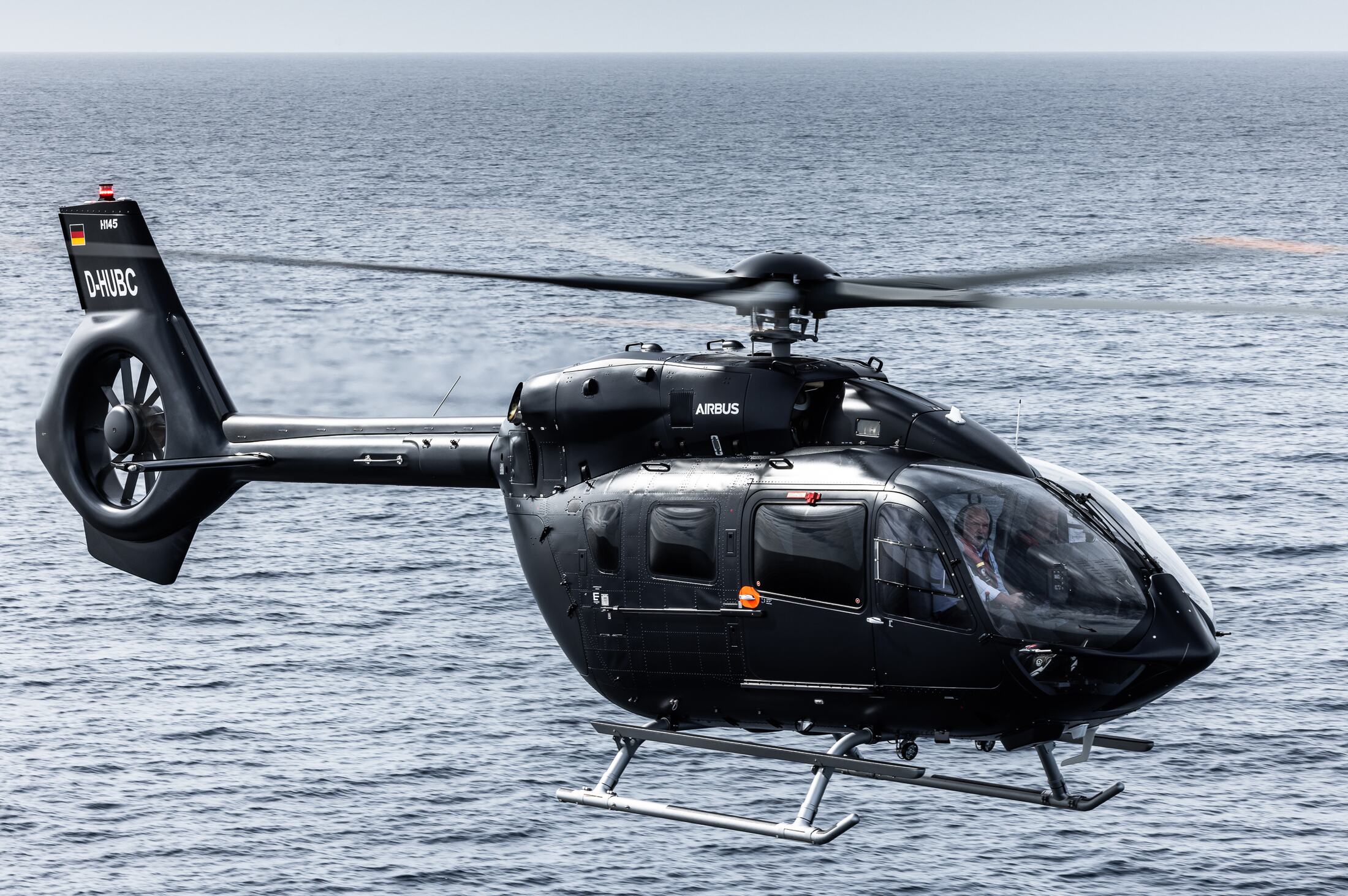 D-HUBC in level flight over the sea