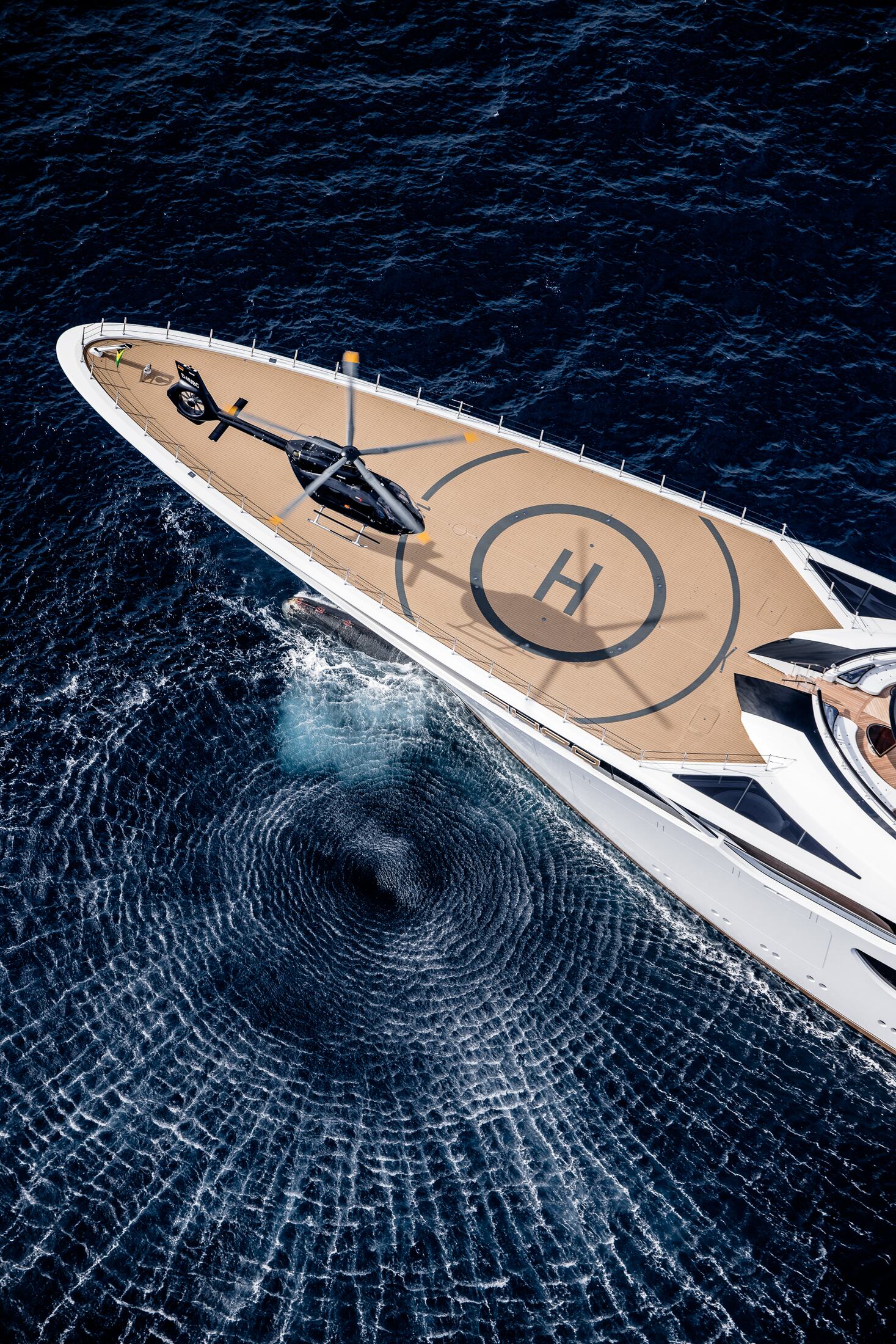 H145 on the helideck of a superyacht, seen from above